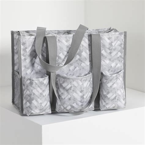 I love the size & sturdiness of this utility tote. . Zip top organizing utility tote